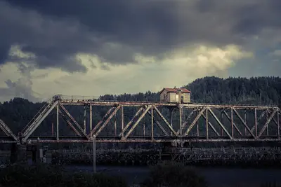 Abandoned building on a bridge (Unsplash)