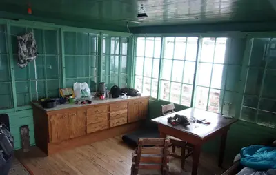 Looking into the Scurvy Mountain Lookout cab from the entry door