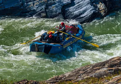 Rafter rowing through Sheep Slot Rapids on Firth River, Ivvavik National Park, YT