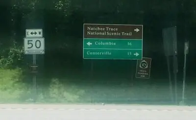 Road sign at the intersection of the Parkway and Tennessee Highway 50 (fcc60fb2-1dd8-b71c-0783-9676a0816d4c)