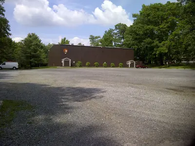 Round Meadow Gymnasium and lot (2339c912-1dd8-b71c-074c-6d19f51a3fea)