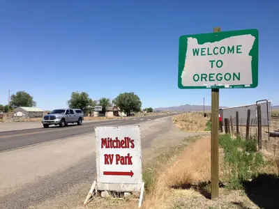 2014-07-06 12 20 24 Welcome to Oregon sign along northbound U.S. Route 95 about 75.4 miles north of the junction with Interstate 80 at the Oregon border in McDermitt, Nevada