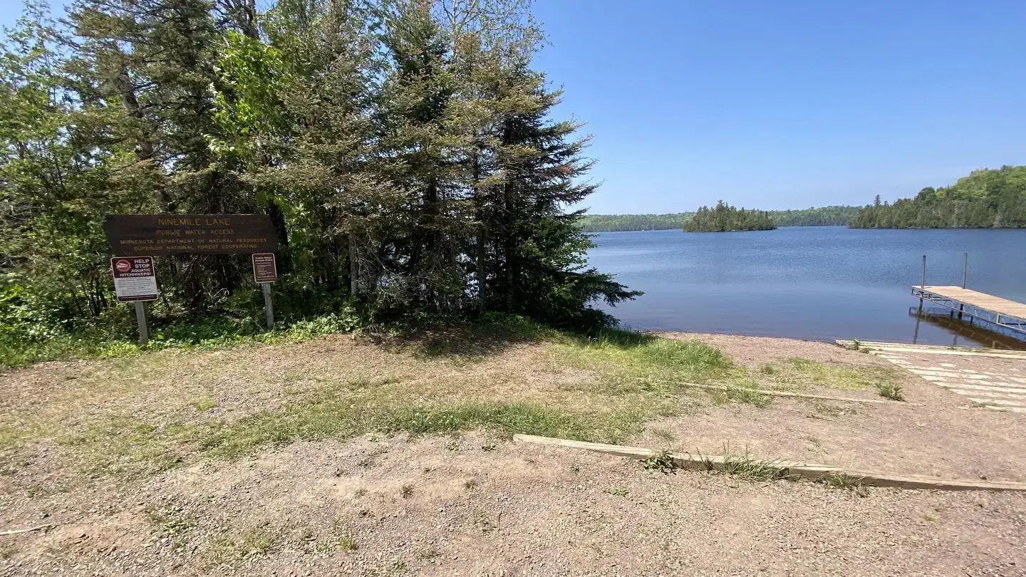 Ninemile Lake sign, lake, and part of the boat launch