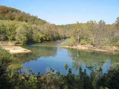 Tree lined banks of the Two Rivers in late summer.