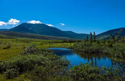 Tundra landscape with mountains and small pond, Ivvavik National Park, YT