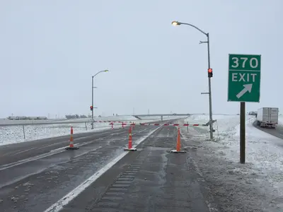 2015-05-09 18 53 21 Gate and cones blocking the main lanes of Interstate 80 during a late spring snowstorm at Exit 370 in Archer, Laramie County, Wyoming