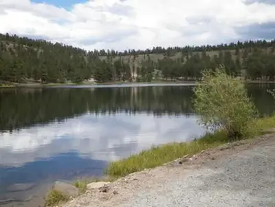 Lake surrounded by hills and trees