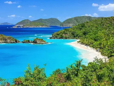 Trunk Bay Beach with white sand beaches, turquoise waters and lush green islands.