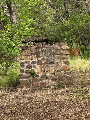 Historical Site John Brown's Cave 1851 Sign, Mayhew Cabin, Nebraska City, 2026