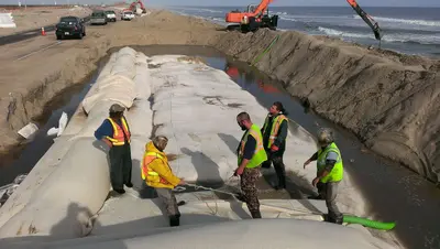 Crews Make Progress on Sandbag Installation