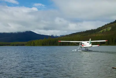 Floatplane bringing gear in, Spruce Lake