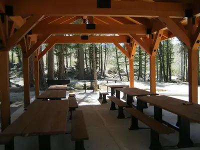 Inside of group shelter, with picnic tables