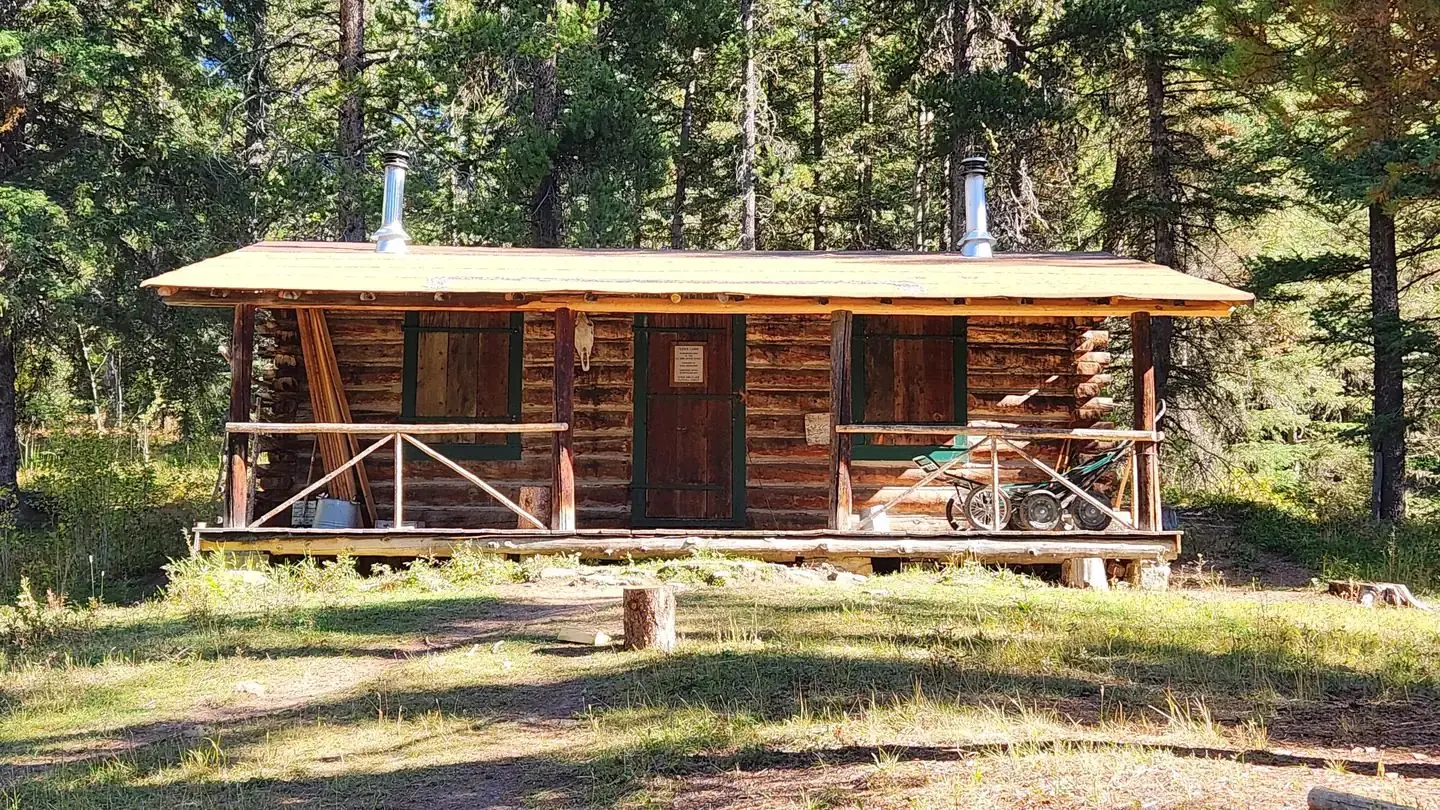 Cabin exterior with path leading up to doorway