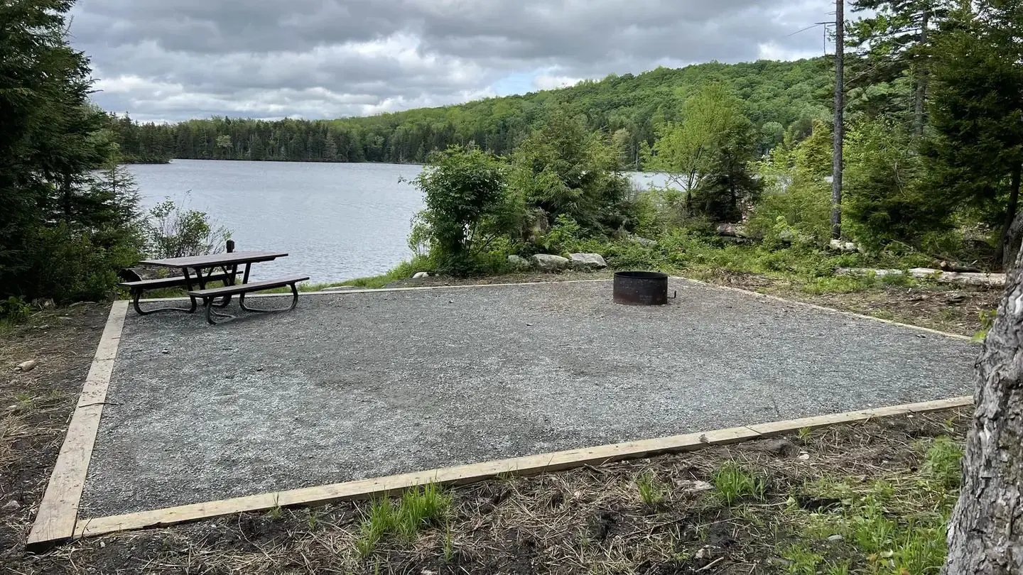pond with picnic table in foreground