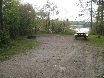 Picture of camping spur with table and fire ring.