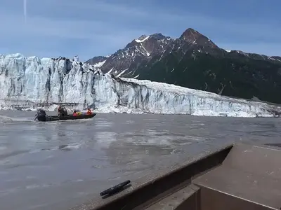 People in a boat in front of Childs Glacier
