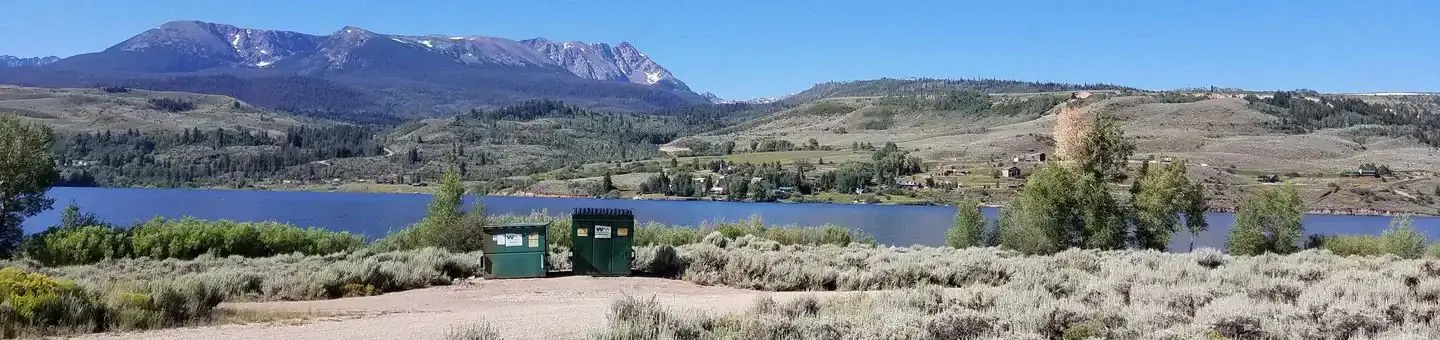 Cow Creek south sage field with reservoir and mountains in background