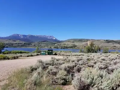 Cow Creek south sage field with reservoir and mountains in background