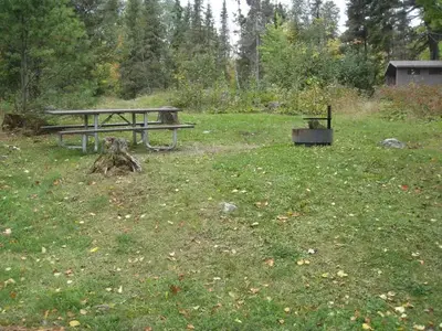 Picture of picnic table and fire ring.