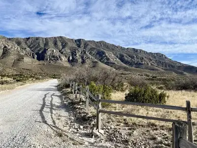 Gravel road leading to the Frijole Ranch area.  Guadalupe Mountains are visible in the background.