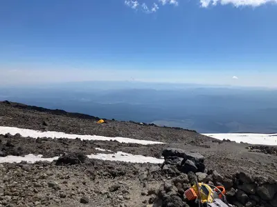 Tents on Mount Adams with Mount Hood in distance