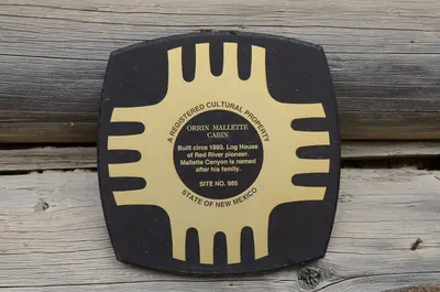 Plaque identifying Orin Mallette Cabin, Red River, NM