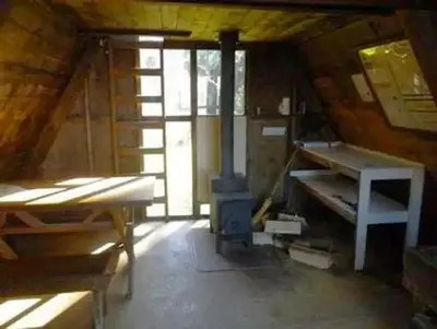 Garnet Ledge Cabin interior with wooden tables and window