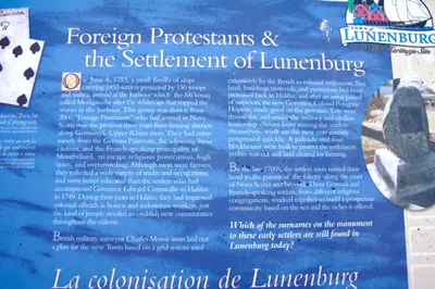 Signage at the Lunenburg Visitor Information Centre, located at the top of Blockhouse Hill Road, Lunenburg, Nova Scotia explains how in 1753 the town was founded by Foreign Protestants from Germany, Switzerland, and Montbeliard, France