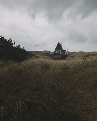 Small hut under overcast sky (Unsplash)