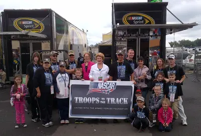 Senator Stabenow with members of the Michigan National Guard at the Michigan International Speedway (9070476444)
