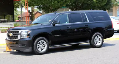 2015 Chevrolet Suburban LT in black, front left side view