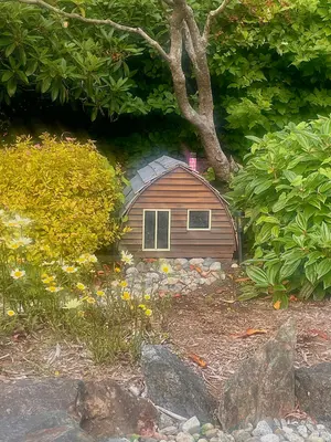 Small model of a log cabin at Ocean Village Beach Resort - Tofino Canada - 2026