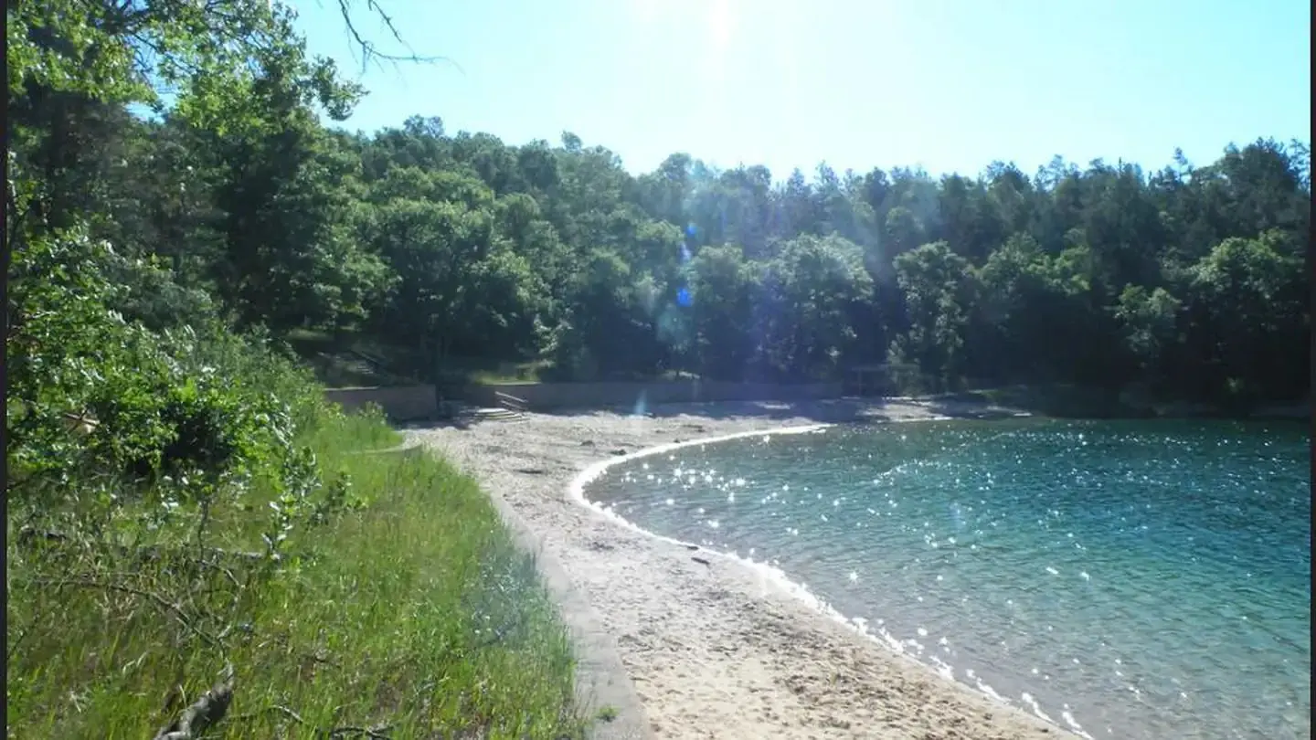 A view of Kneff Lake and Kneff Lake Day Use Area beach.