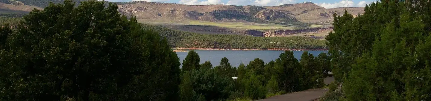 This camp site is near the lake. On the other side of the lake are hills, meadows and deep ravines.