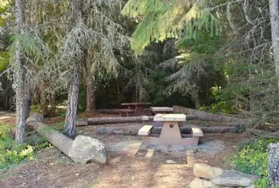 Picnic tables in the communal eating area for hike-to sites