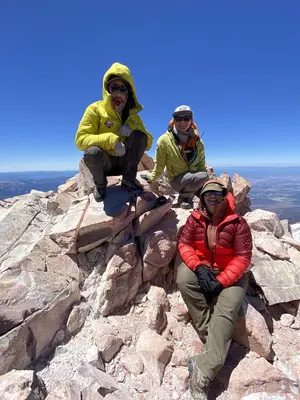 Forest Supervisor Rachel Birkey is triumphant on the top of Mount Shasta (USDA Forest Service photo by Nick Meyers) (20220626-FS-NM-012)