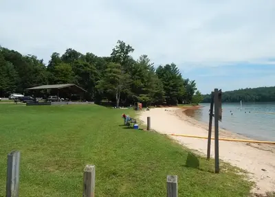 A grassy approach as you head toward the sandy beach and swim area at Philpott Lake's Goose Point.