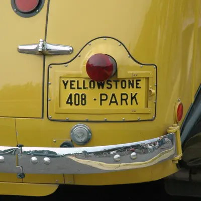 License plate on a classic yellow tour bus in Canyon Village, Yellowstone National Park, 2009