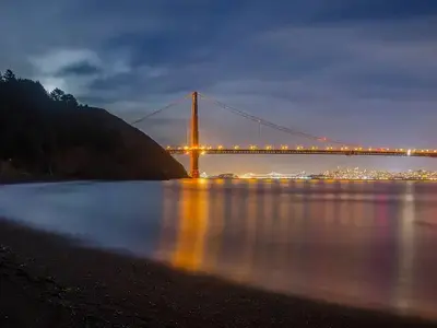 A view of the bay from Kirby Cove, with the Golden Gate Bridge lit.