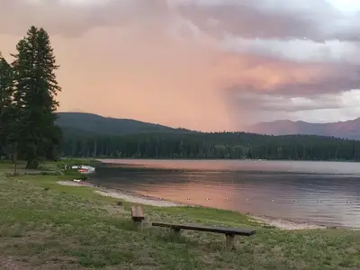 View from Seeley Lake swim beach at dusk. A storm rolls in from the East.