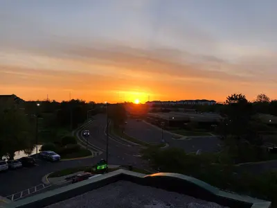 2022-04-29 06 23 19 Sunrise with cirrus clouds viewed from the Wingate by Wyndham along Centerview Drive in Chantilly, Fairfax County, Virginia