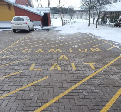 Milk truck reserved parking at a Montebello cheese production facility. The French wording says "Camion à lait", which means "Milk truck")