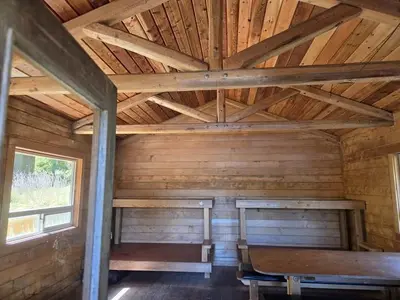 Interior of cabin with 2 bunk beds and table