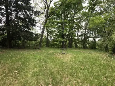 Benches and flag pole overlooking the river.
