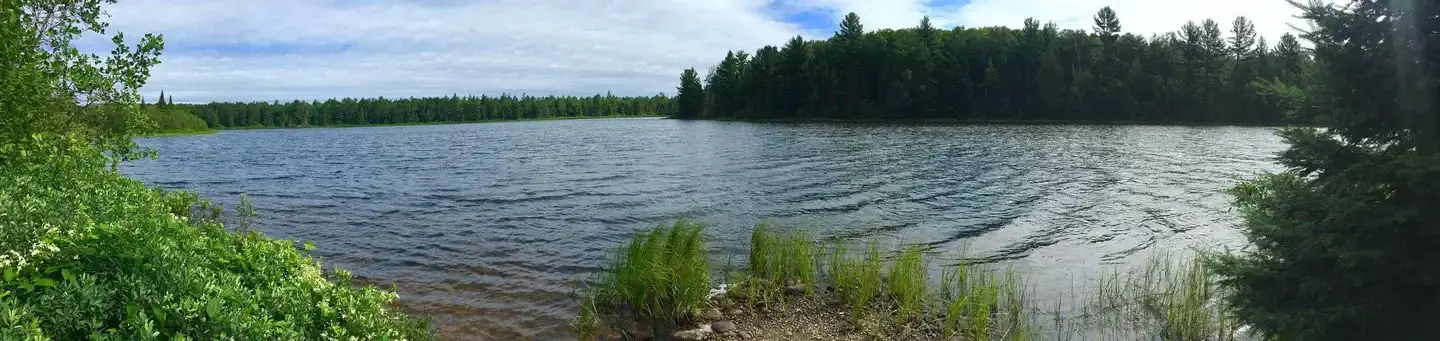 Lake off the shore of Little Beaver Campground on sunny day
