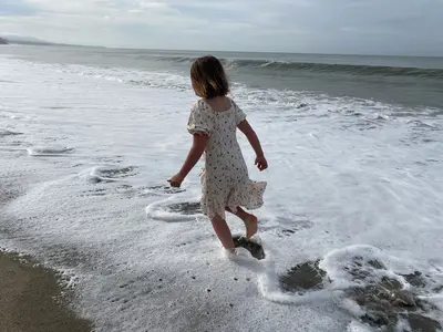 Girl playing in surf