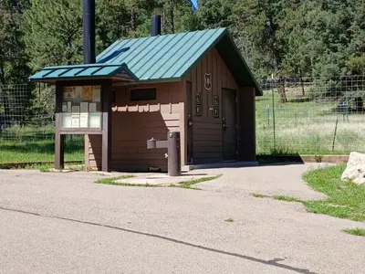 Pines signboard and restroom