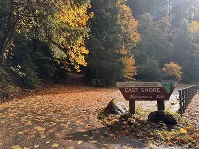 East Shore Campground and Day Use Area entrance with sign in foreground