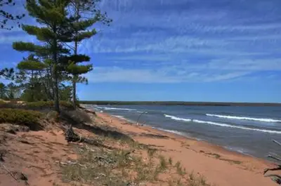 A sandy beach and waves