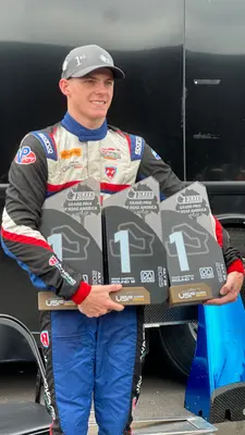 Liam Loiacono posing with trophies after wins at Road America